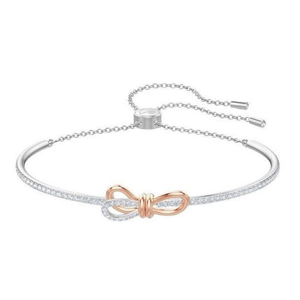 Swarovski Lifelong Bow Rhodium Plated Oval Shaped Bangle With White Crystal 5447079 For Women